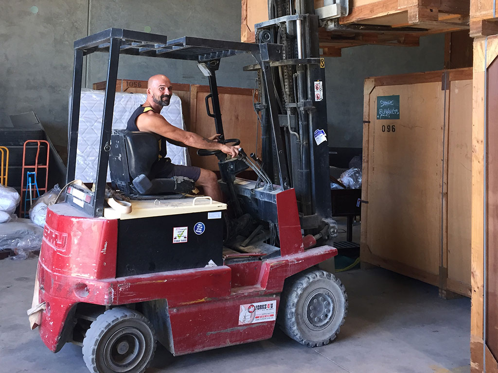 Smiling Worker Driving a Forklift - Home & Office Removals in Mackay, QLD