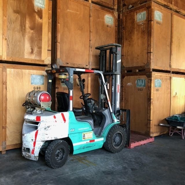 Forklift Parked in front of Large Crates - Home & Office Removals in Mackay, QLD