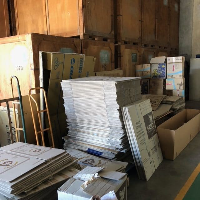 Flattened Cardboard Boxes Stacked in Piles - Home & Office Removals in Mackay, QLD