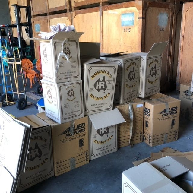 Cardboard Moving Boxes Stacked in a Warehouse - Home & Office Removals in Mackay, QLD