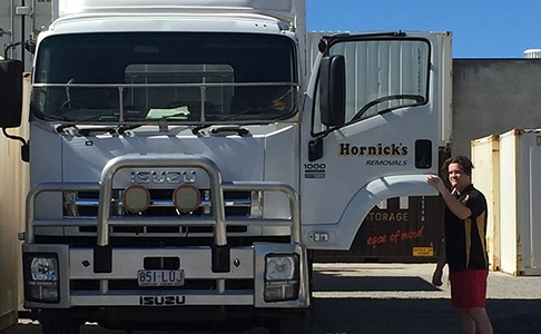 Man Entering Hornick's Removal Truck — Hornicks Furniture Removals in Mackay, QLD