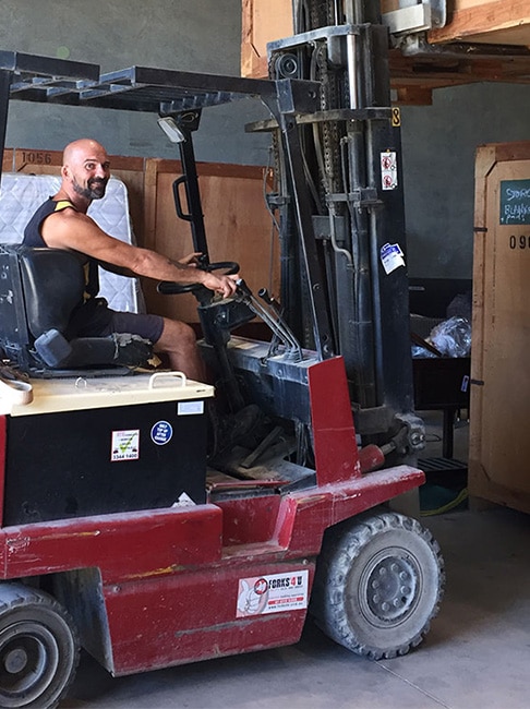 Man Using Forklift — Hornicks Furniture Removals in Emerald, QLD